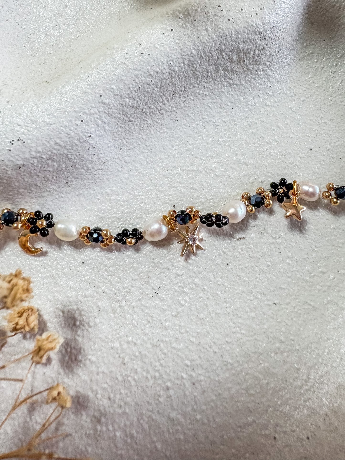 Black Beaded Flower Bracelet with Moon and Stars