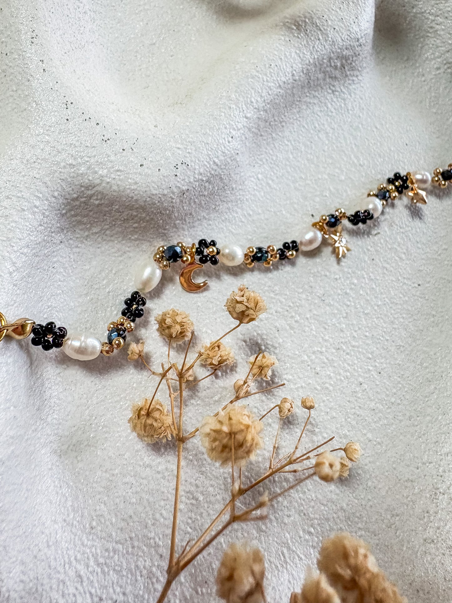 Black Beaded Flower Bracelet with Moon and Stars